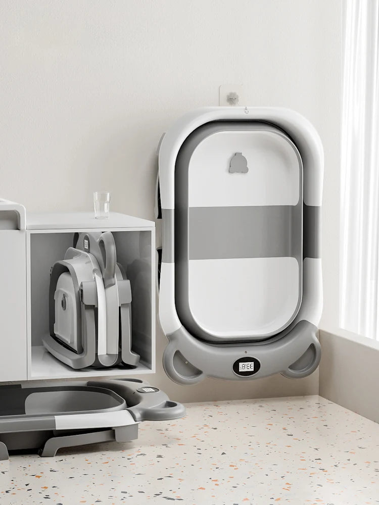 Baignoire bébé pliable pour nouveau-né avec thermomètre intégré et coussin flottant doux, baignoire de voyage portable avec trou de vidange.