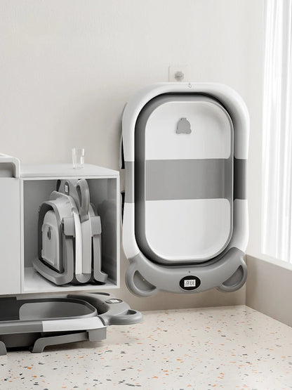 Baignoire bébé pliable pour nouveau-né avec thermomètre intégré et coussin flottant doux, baignoire de voyage portable avec trou de vidange.